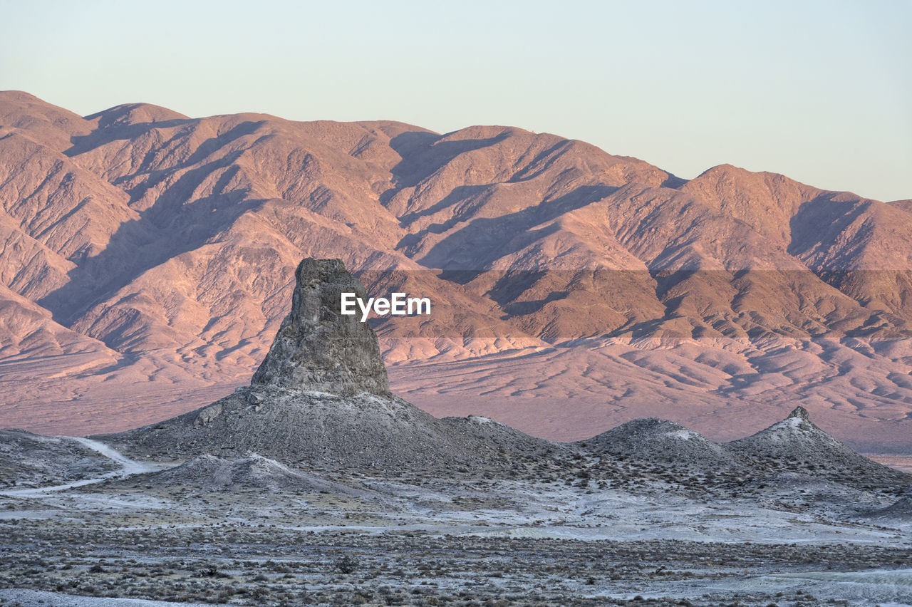 Scenic view of rock formation at desert against sky