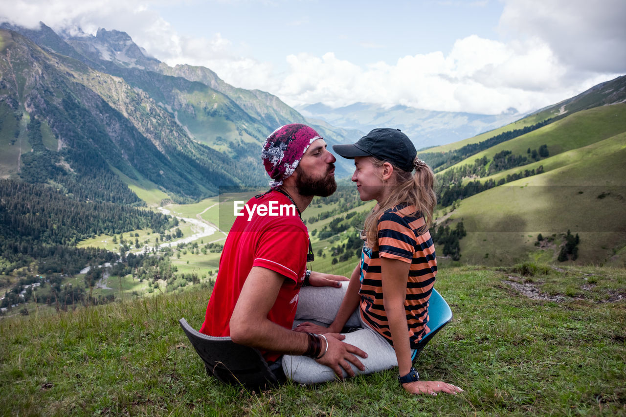 Couple sitting on mountain
