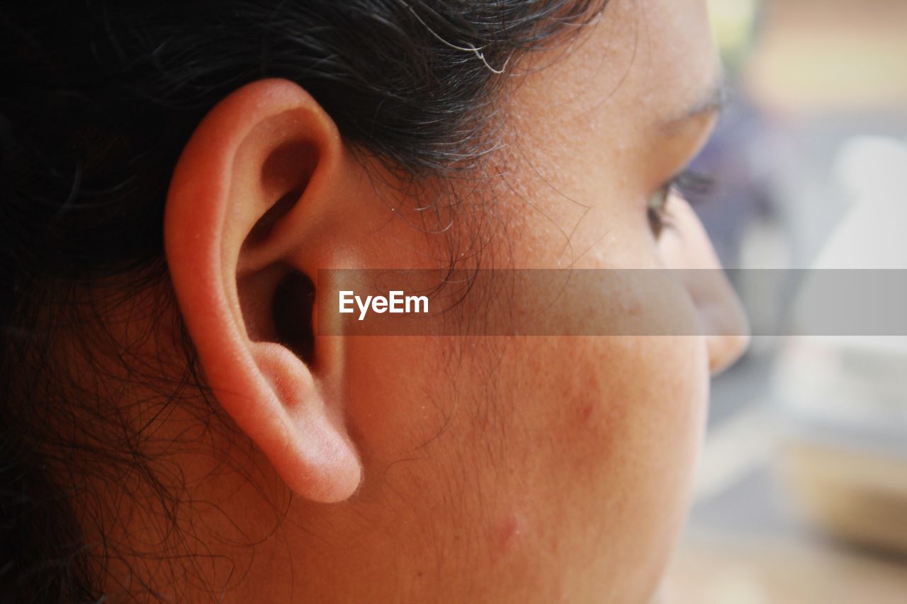 Cropped image of woman ear