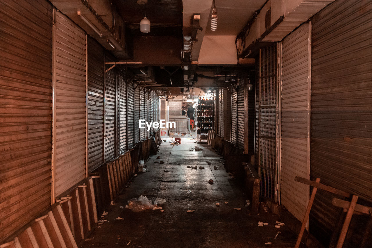 VIEW OF NARROW CORRIDOR ALONG BUILDINGS