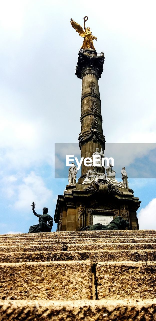 LOW ANGLE VIEW OF STATUES AGAINST SKY