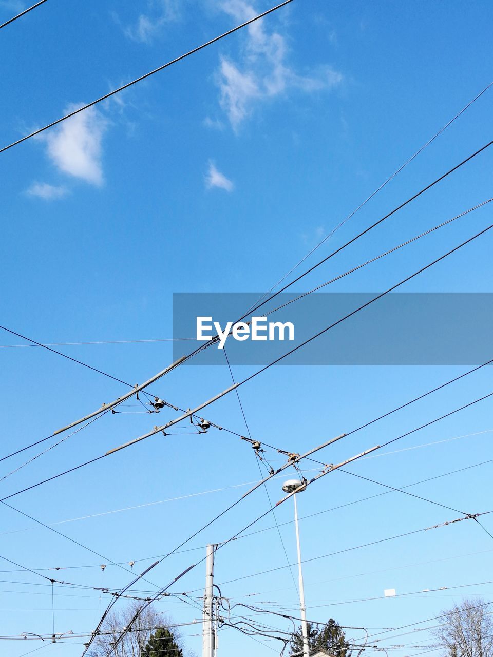 LOW ANGLE VIEW OF POWER LINES AGAINST SKY