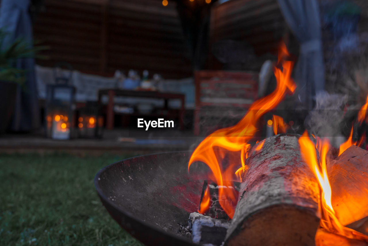 close-up of fire in container at night