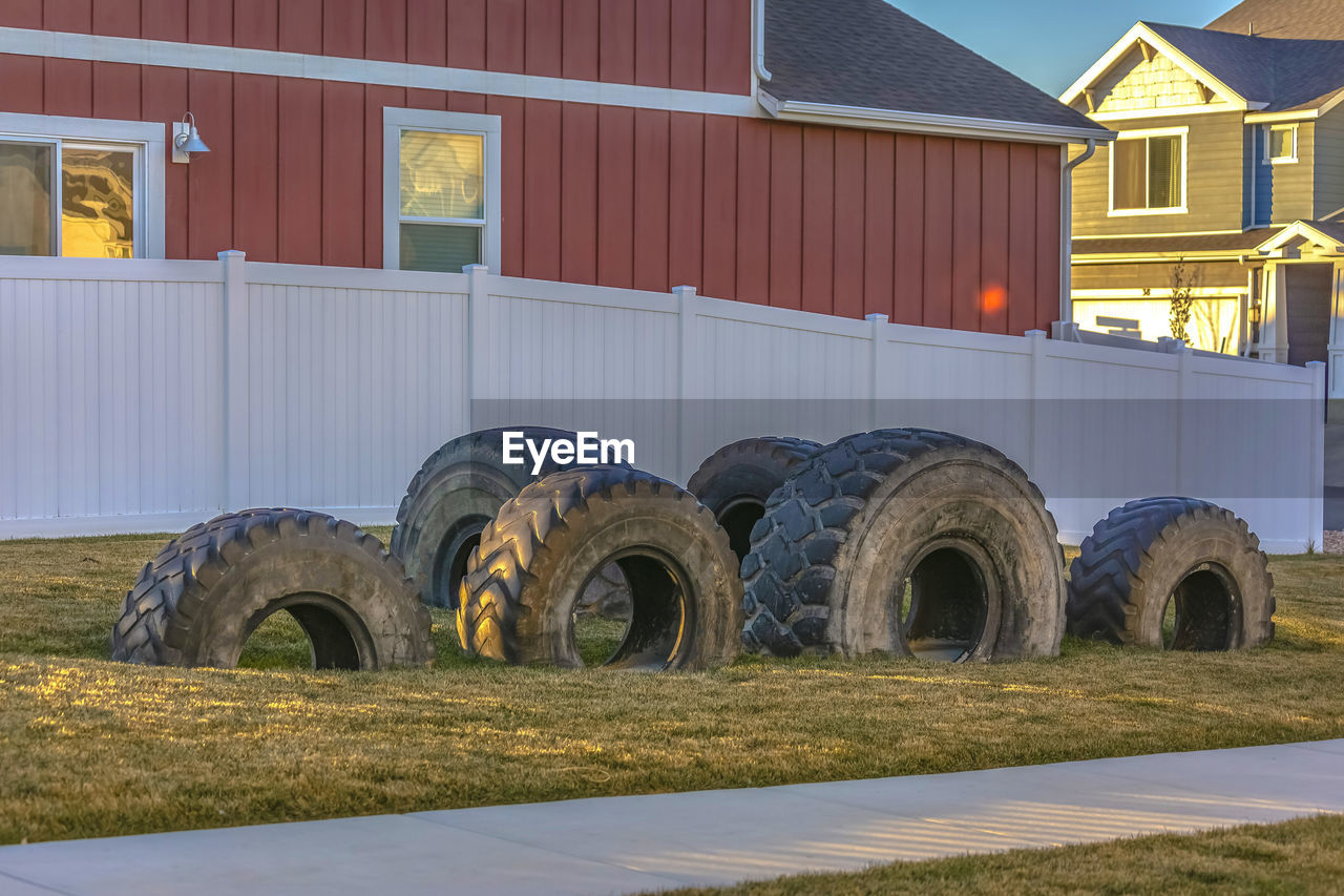 BARN ON FIELD BY HOUSES