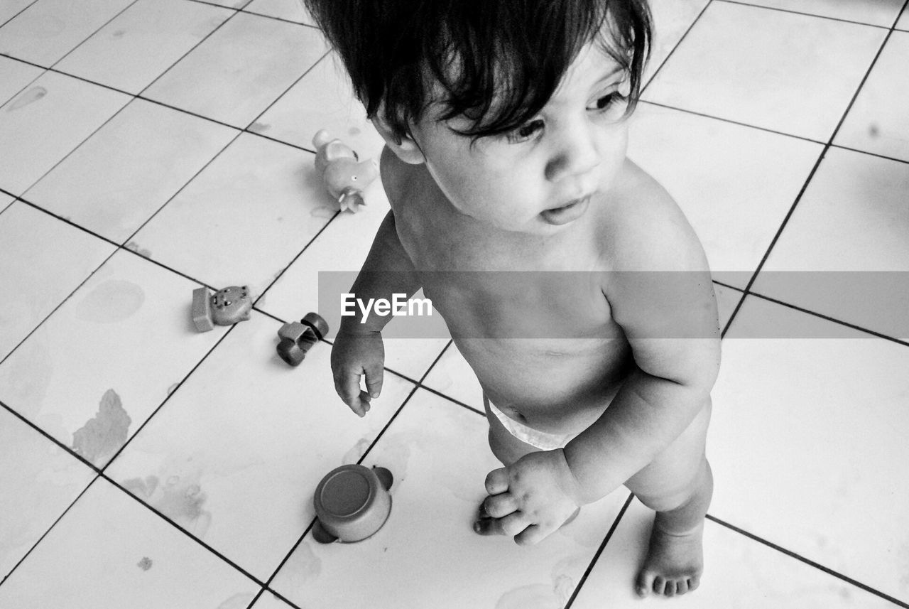 High angle view of toddler playing with toys at home