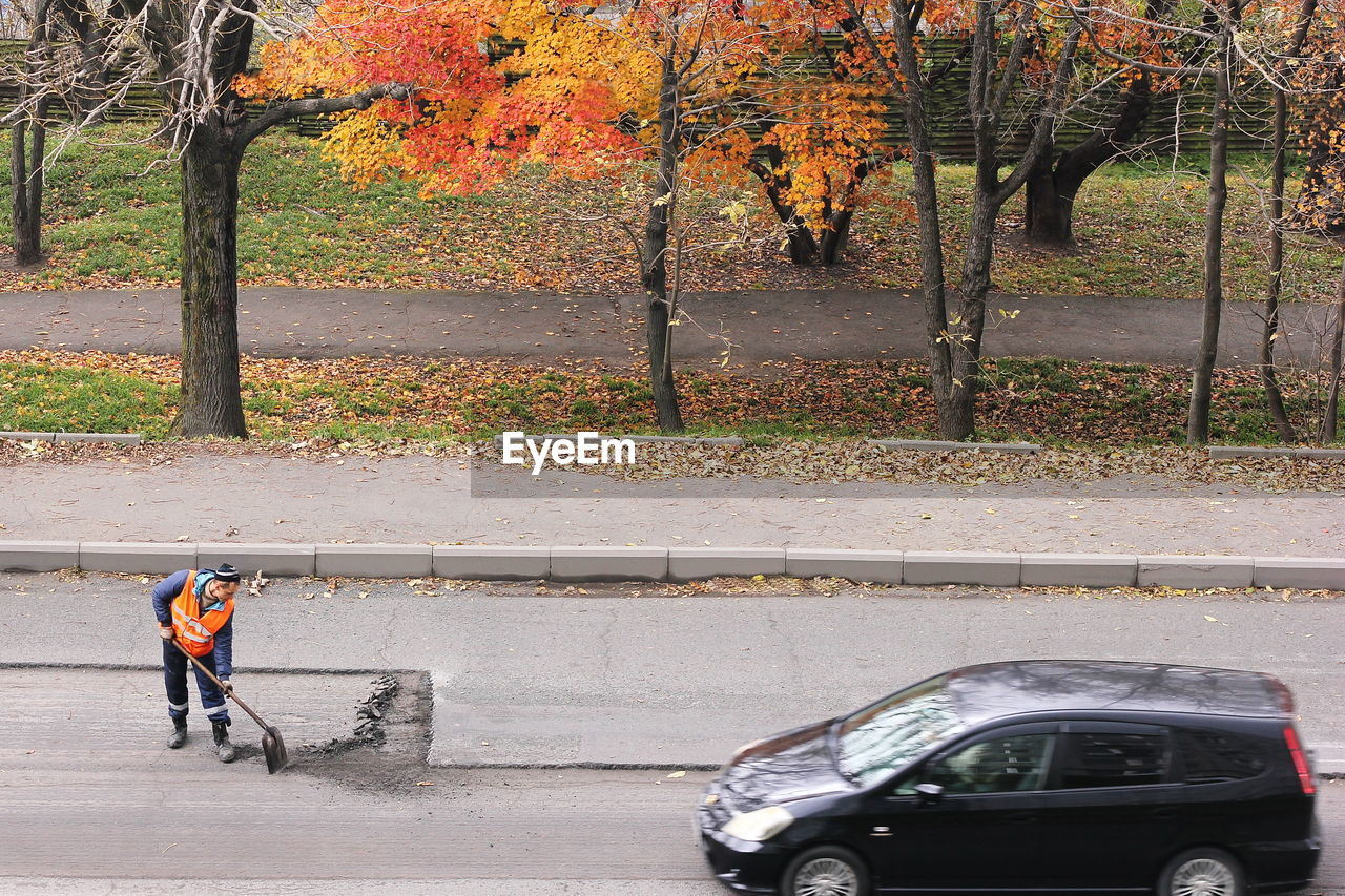 PEOPLE ON STREET DURING AUTUMN