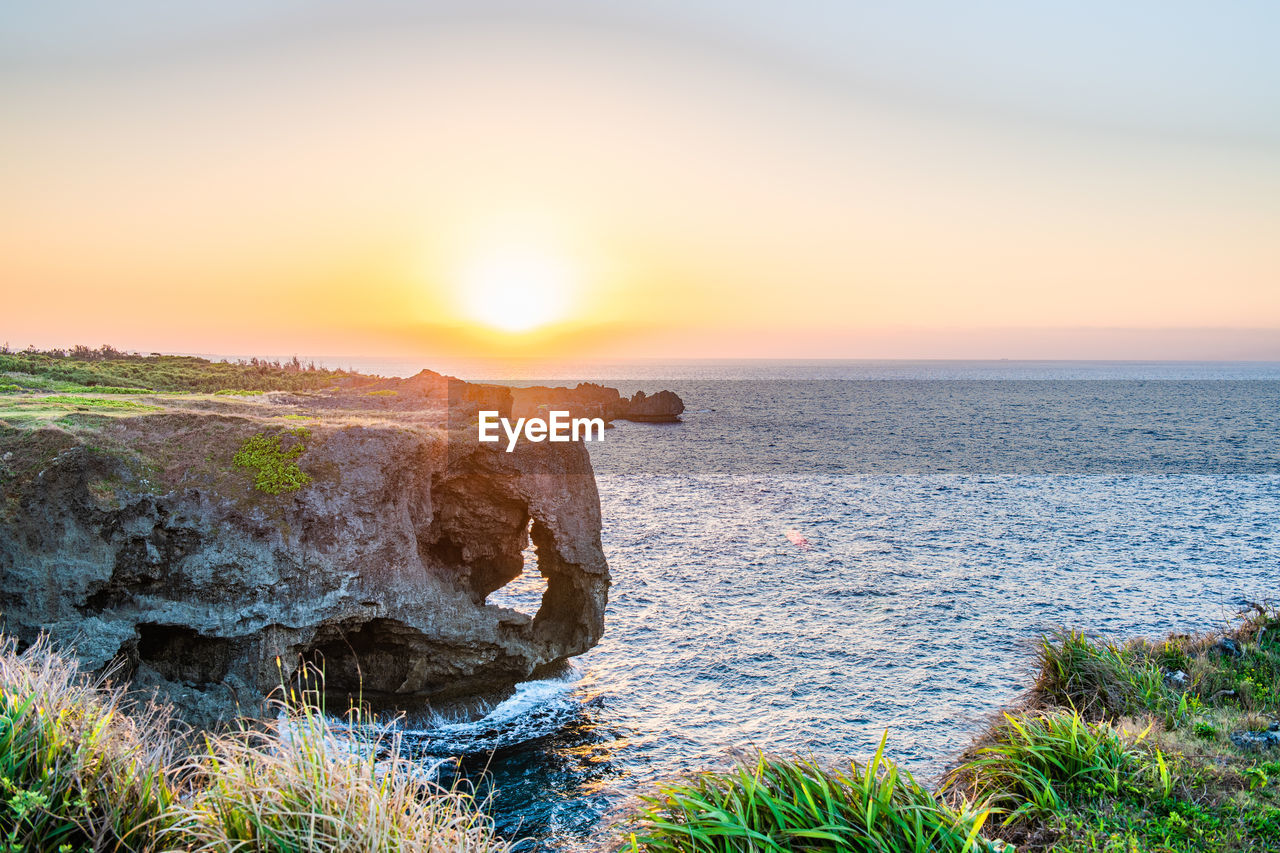 Scenic view of sea against sky during sunset