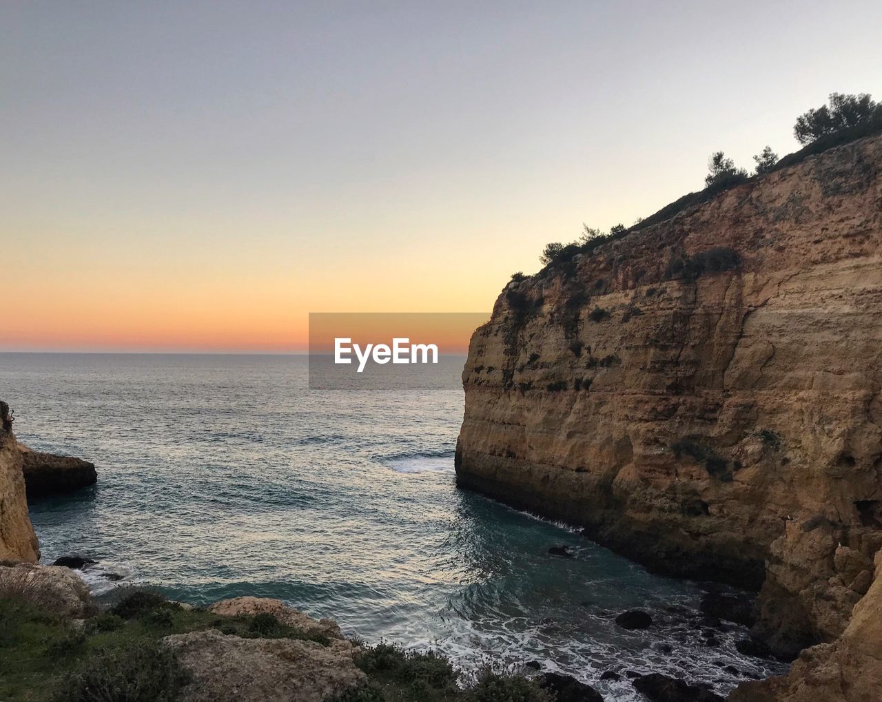 Scenic view of sea against sky during sunset