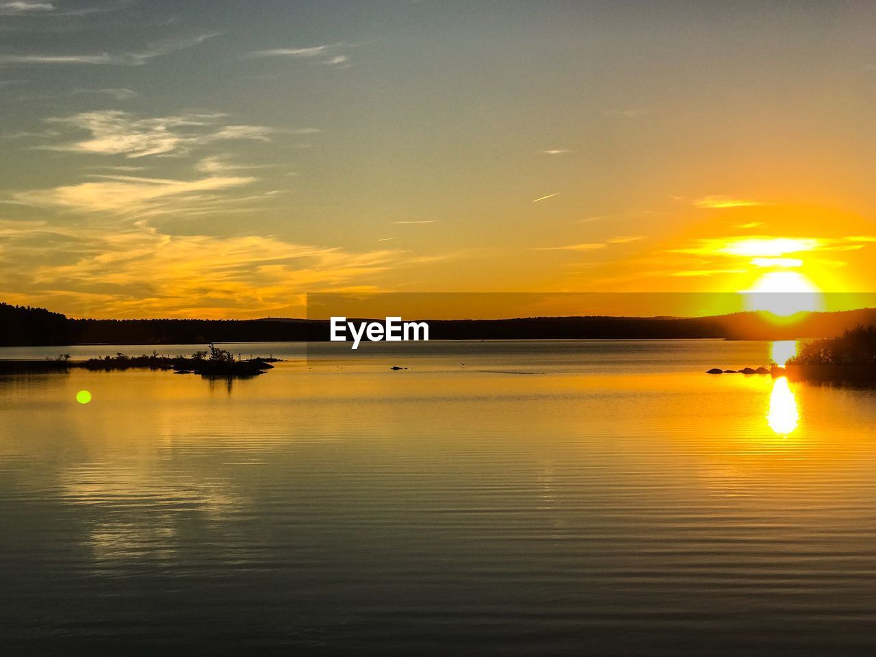 View of calm sea at sunset