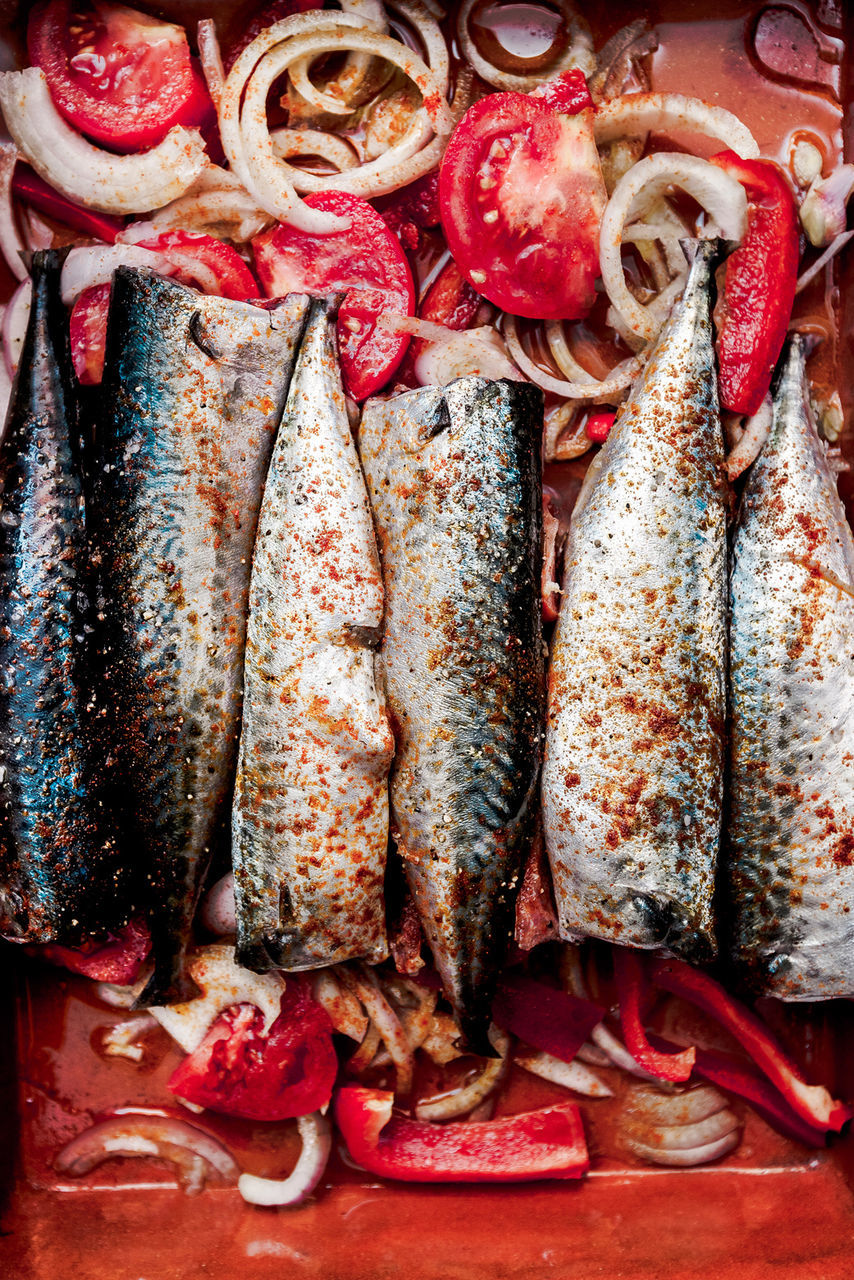 Directly above view of fresh fish with sliced vegetables