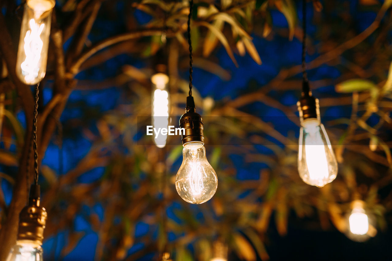 Low angle view of illuminated light bulb