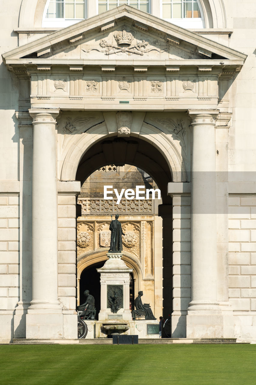 STATUE IN FRONT OF BUILDING