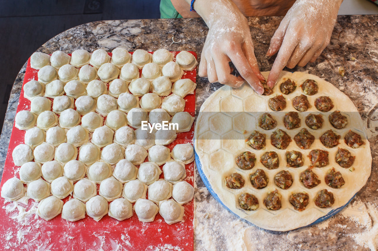 Cropped hands of woman preparing food