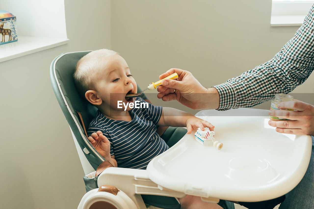 High angle view of mother and daughter at home