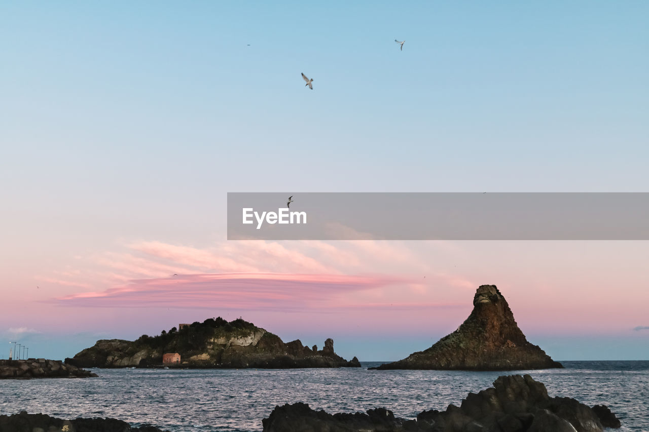 Scenic view of sea against sky during sunset