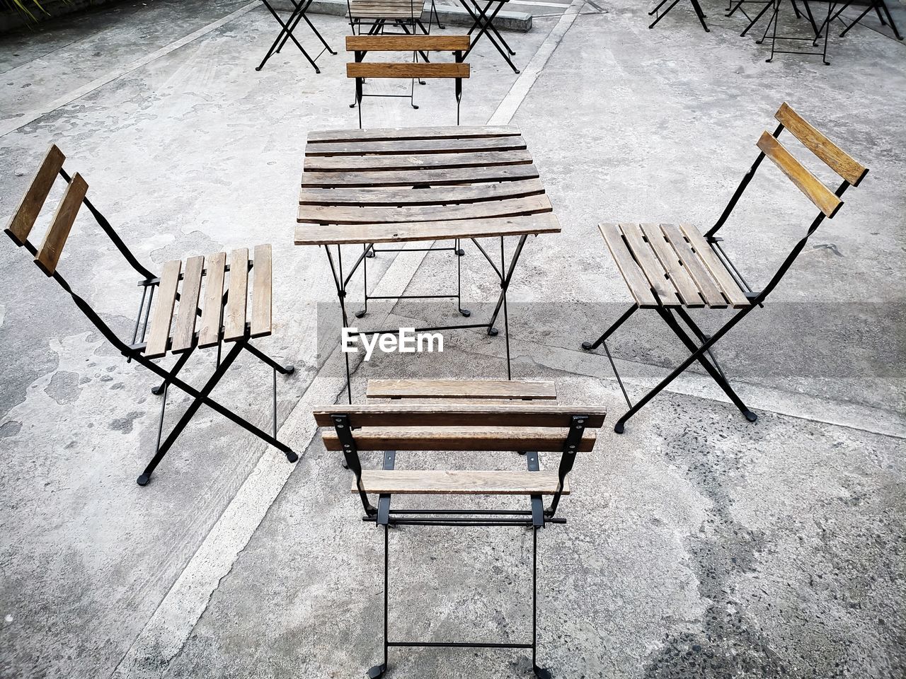 HIGH ANGLE VIEW OF EMPTY CHAIRS AND TABLES