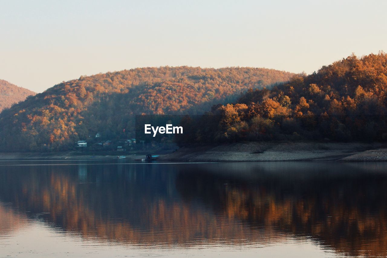 Scenic view of lake against sky during autumn