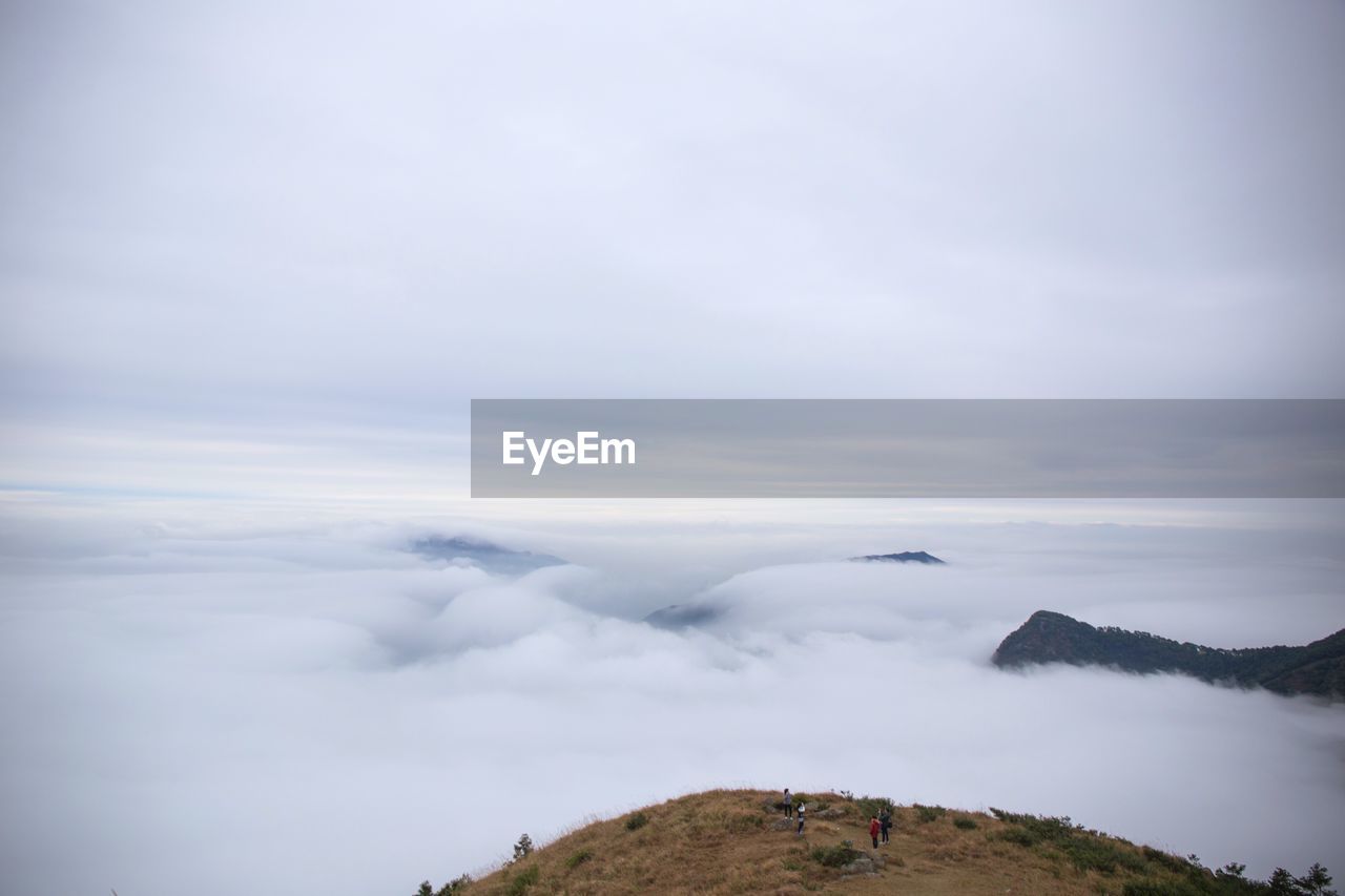 High angle view of mountains amidst clouds