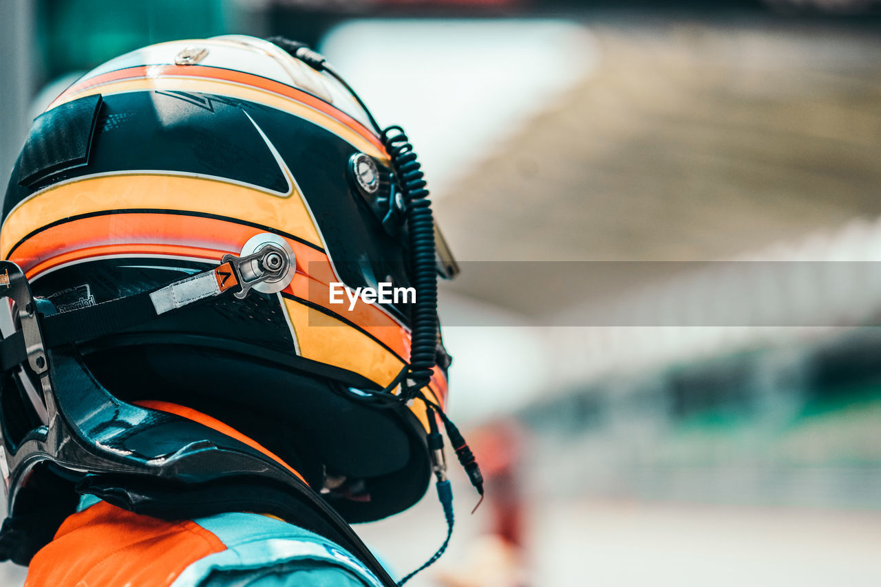 Close-up of person wearing crash helmet