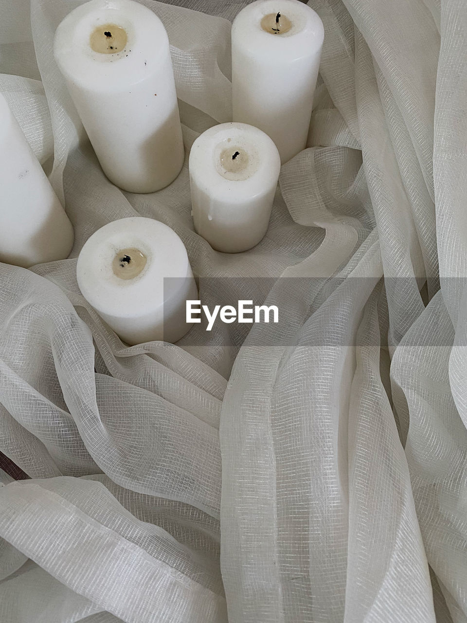 candle, white, indoors, textile, no people, ceramic, high angle view