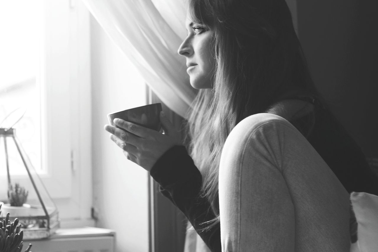 YOUNG WOMAN LOOKING AT CAMERA