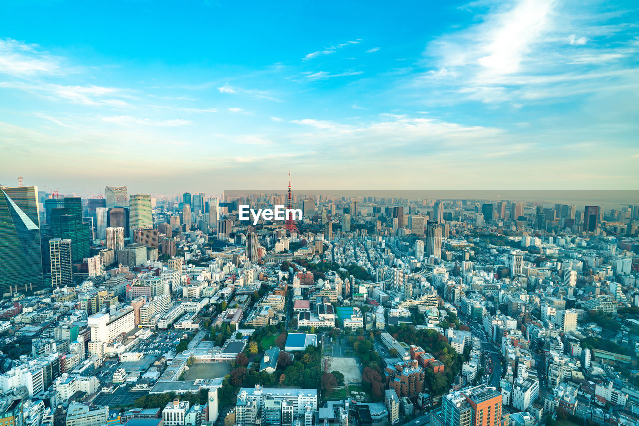 HIGH ANGLE VIEW OF MODERN CITY BUILDINGS AGAINST SKY