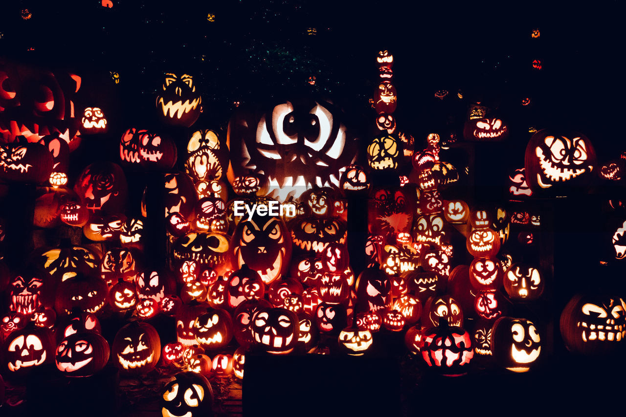 LOW ANGLE VIEW OF ILLUMINATED LANTERNS