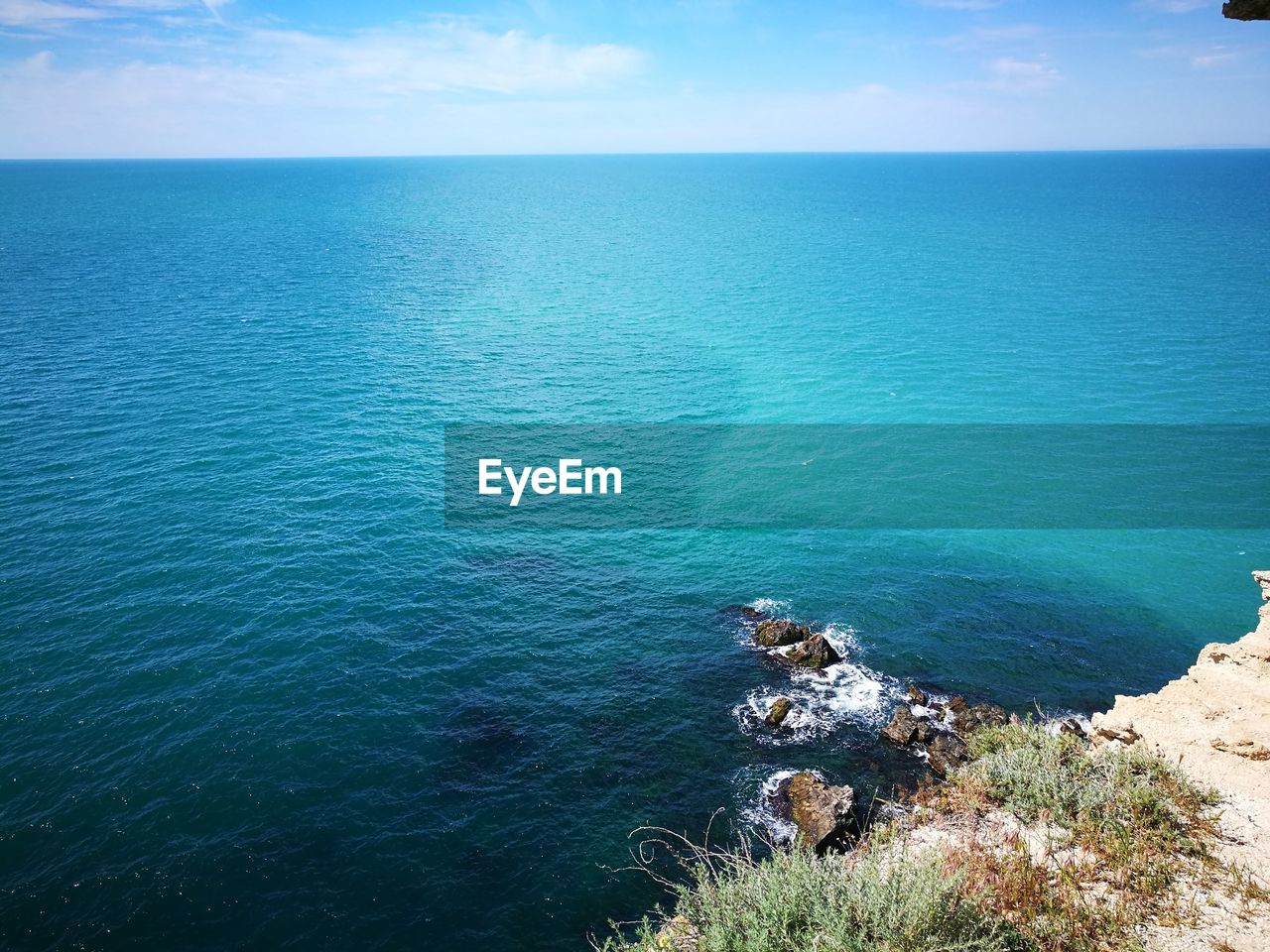 High angle view of sea against blue sky