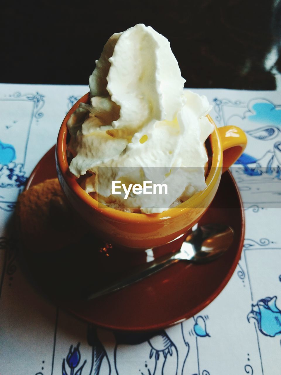 Close-up of dessert in mug on table
