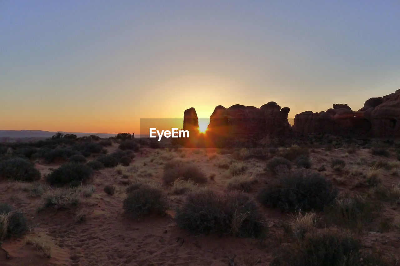 VIEW OF LANDSCAPE AT SUNSET