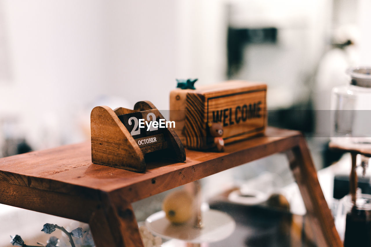 CLOSE-UP OF TEXT ON TABLE