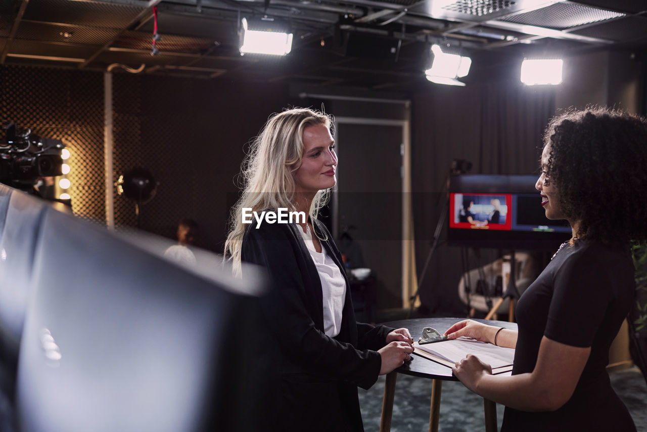 Female news anchors in studio