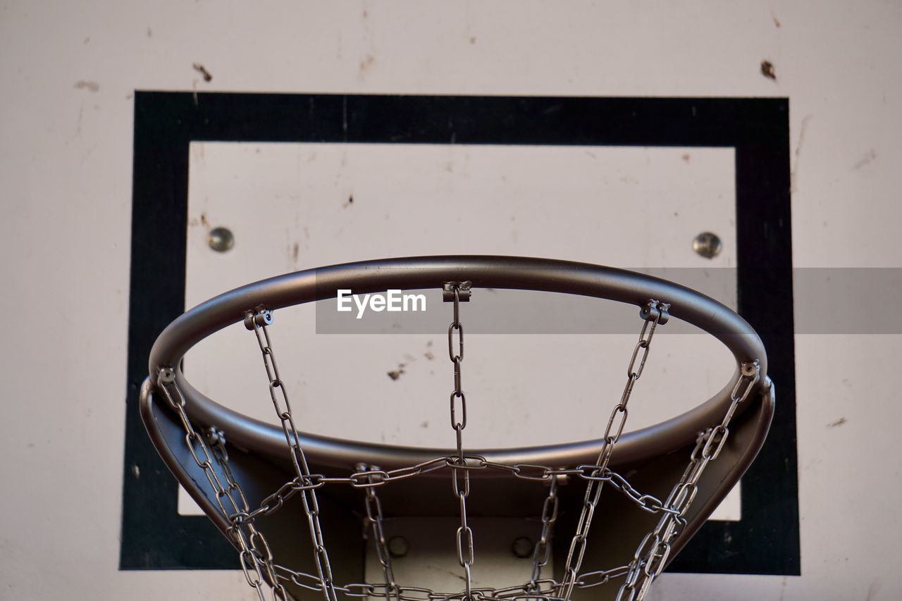 Basketball sport hoop with metallic net in the street