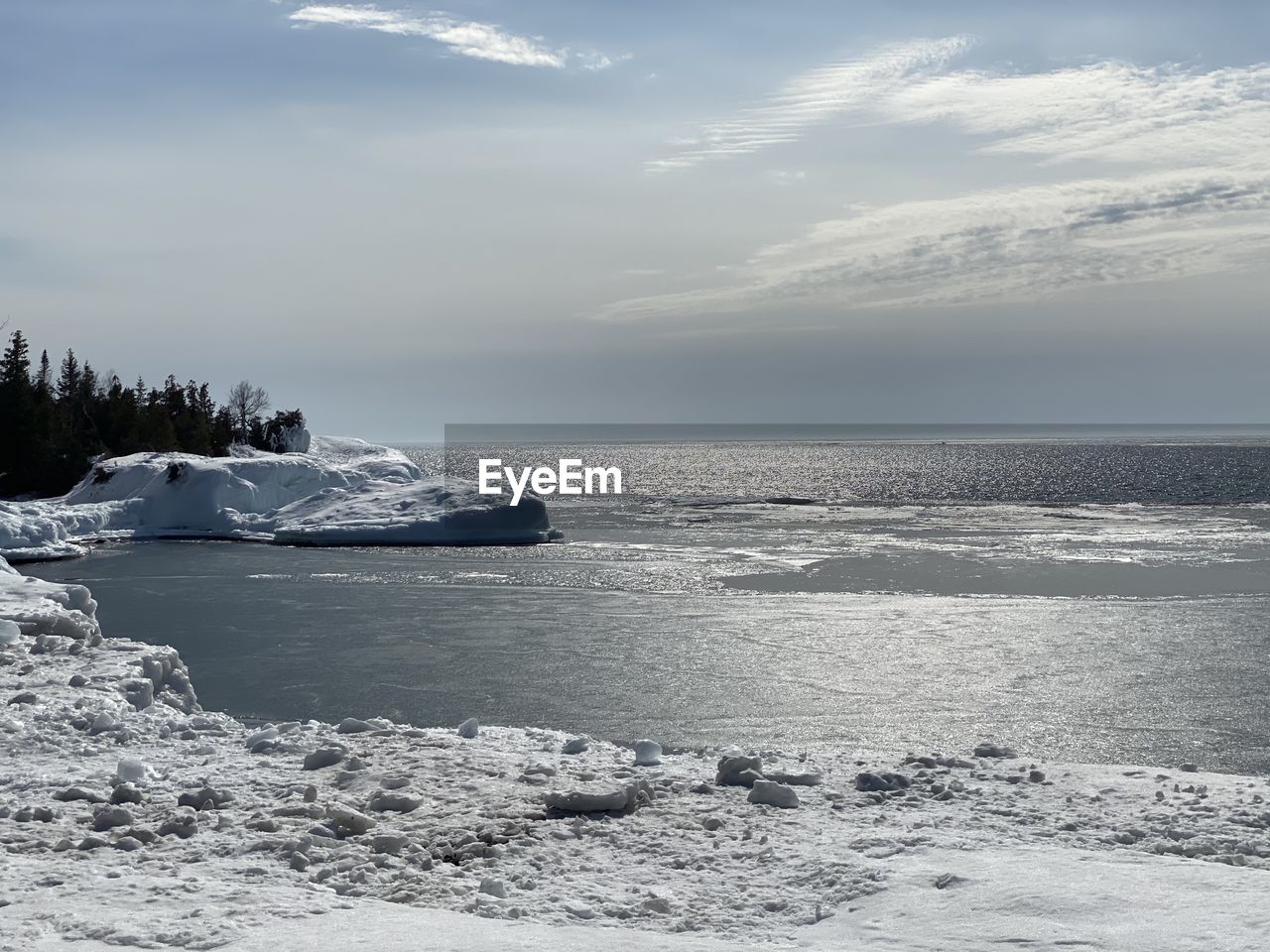 Scenic view of sea against sky during winter