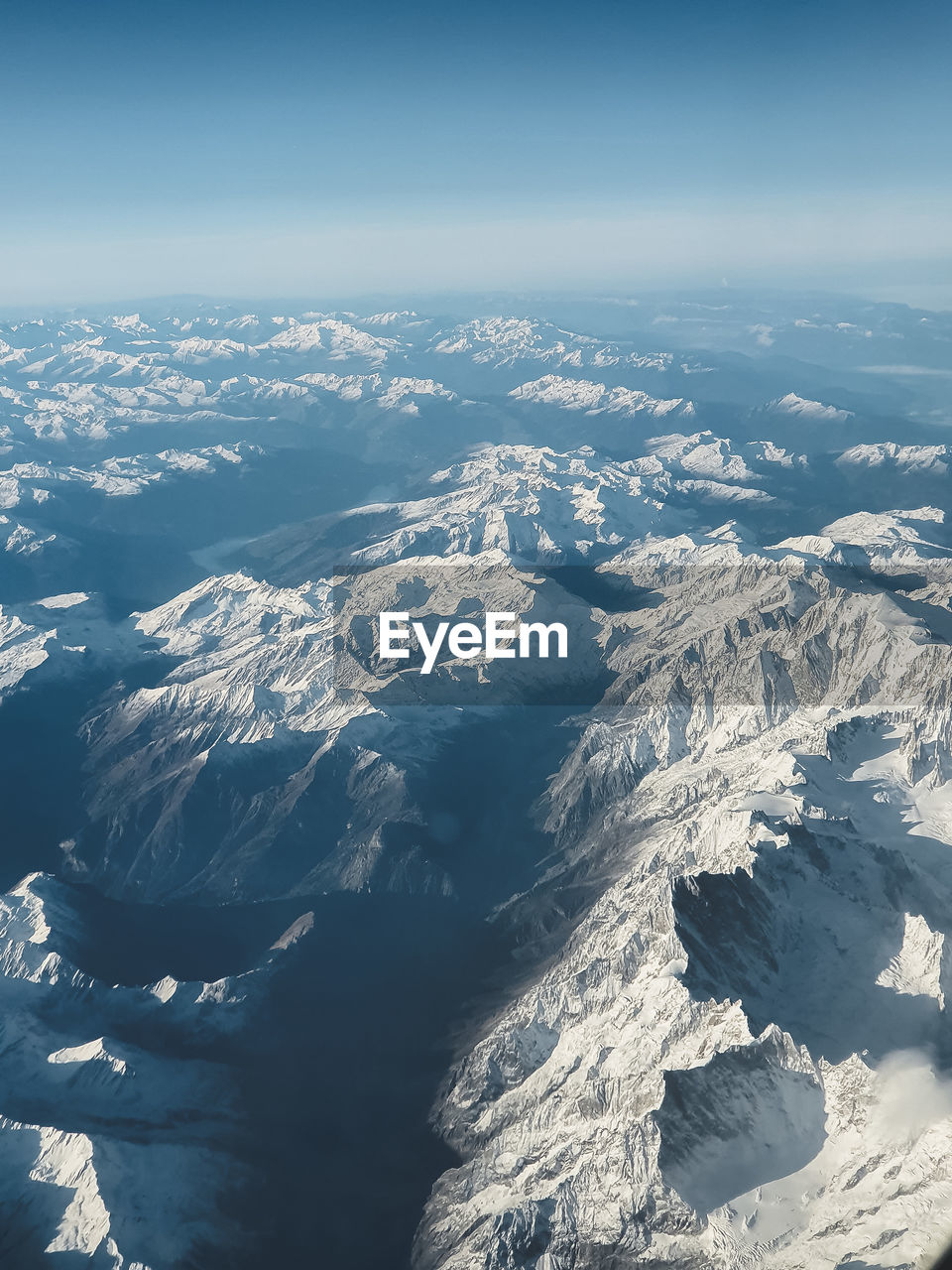 Aerial view of snow capped mountain range