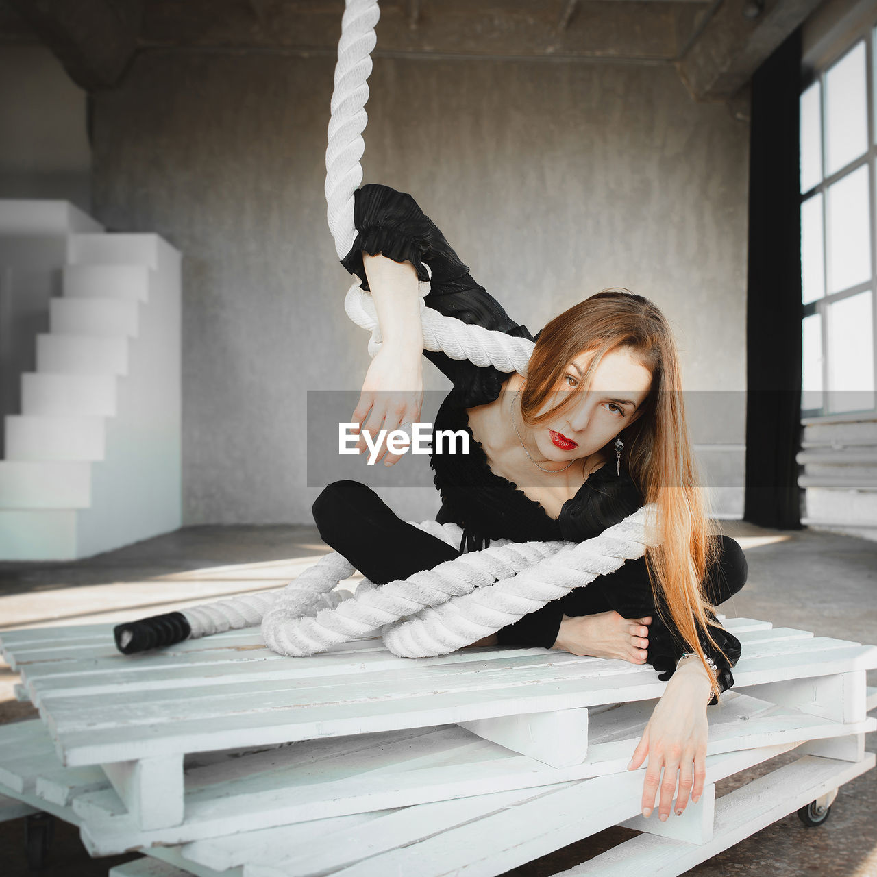 Low angle view of young woman working at home