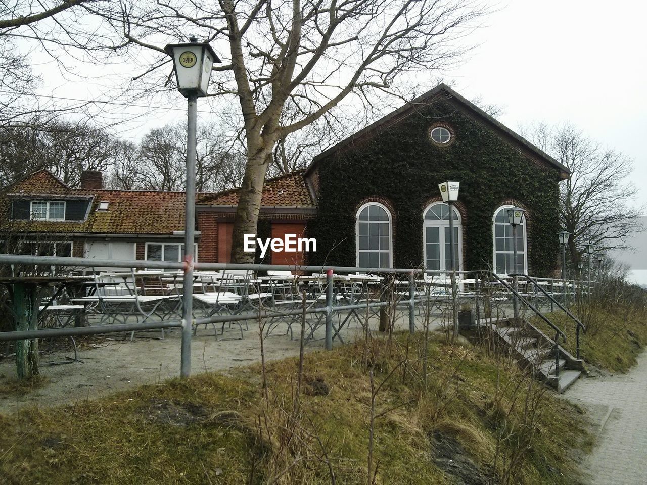 BUILT STRUCTURE WITH TREES IN FOREGROUND