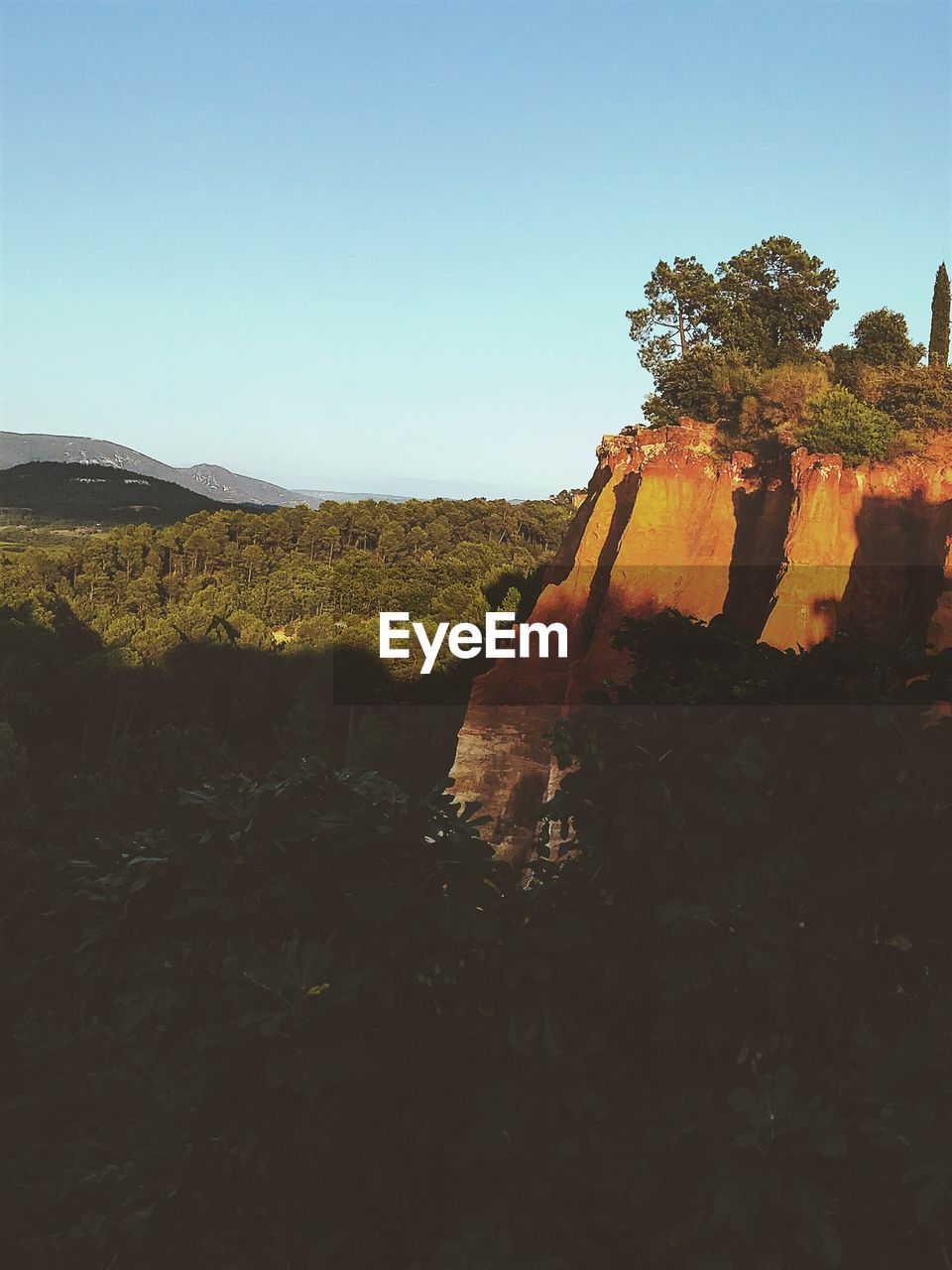 Scenic view of land against clear sky