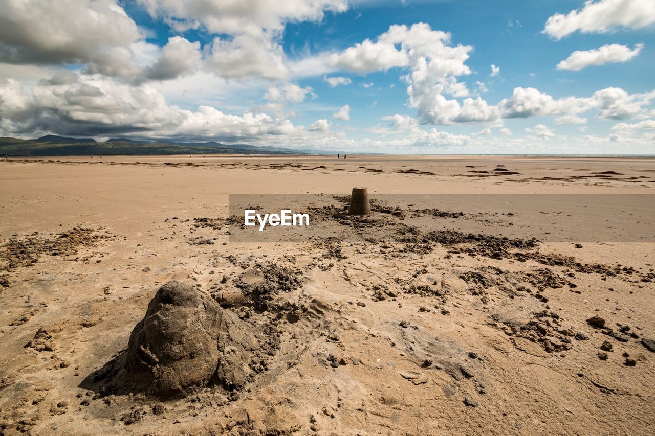 Mid distant view of sand castle on shore at beach