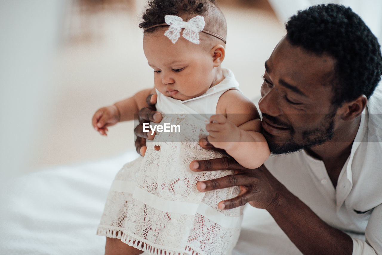 Father playing with daughter