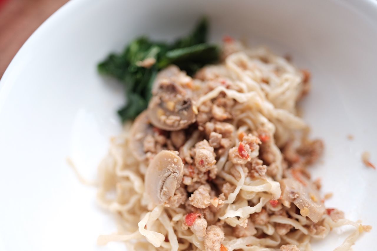 CLOSE-UP OF PASTA WITH SALAD