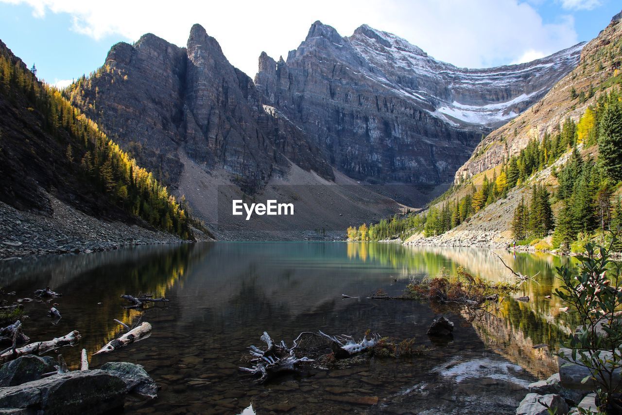 Scenic view of lake and mountains against sky