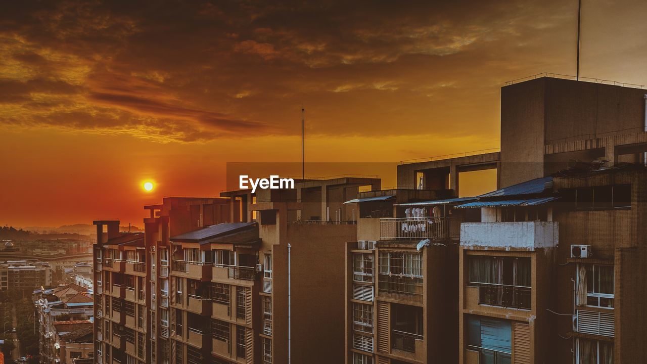 Cityscape against sky during sunset