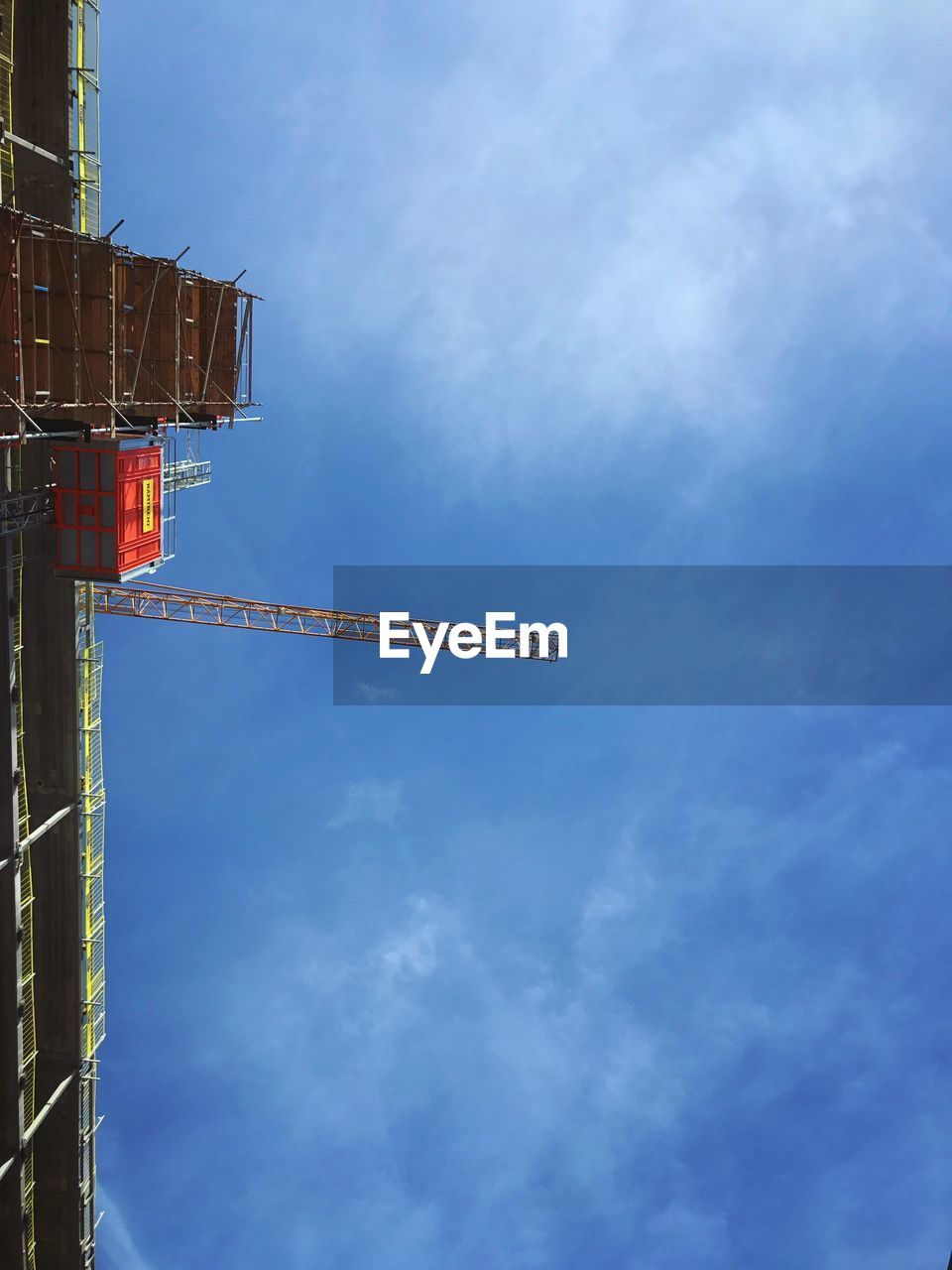 LOW ANGLE VIEW OF COMMUNICATIONS TOWER AGAINST SKY