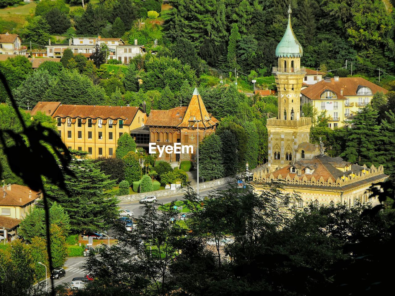 High angle view of trees and buildings in city