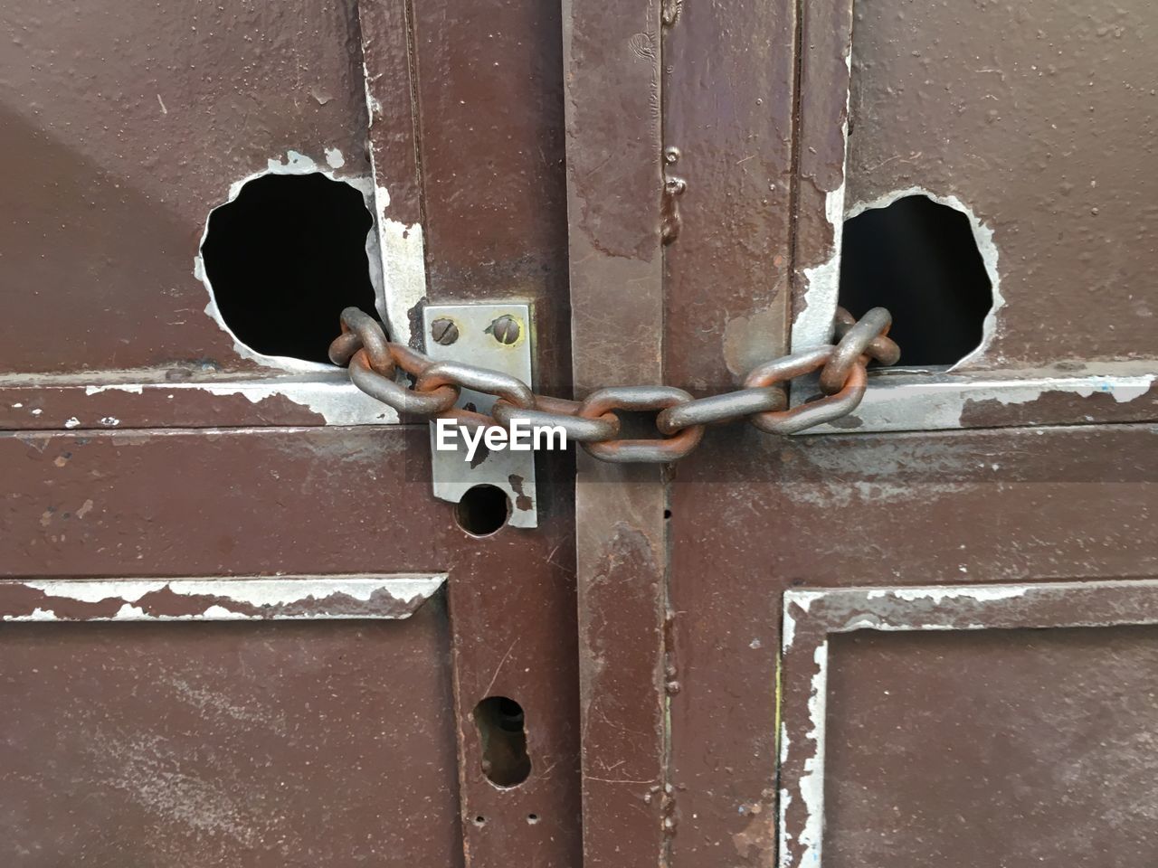 CLOSE-UP OF PADLOCK ON DOOR