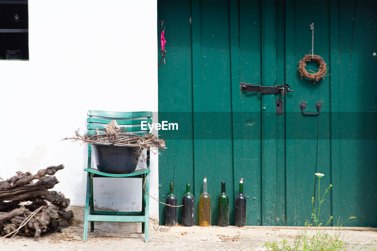 door, entrance, green, wood, architecture, building exterior, built structure, day, no people, closed, building, blue, wall, nature, house, outdoors, shed, protection, container, wall - building feature, old