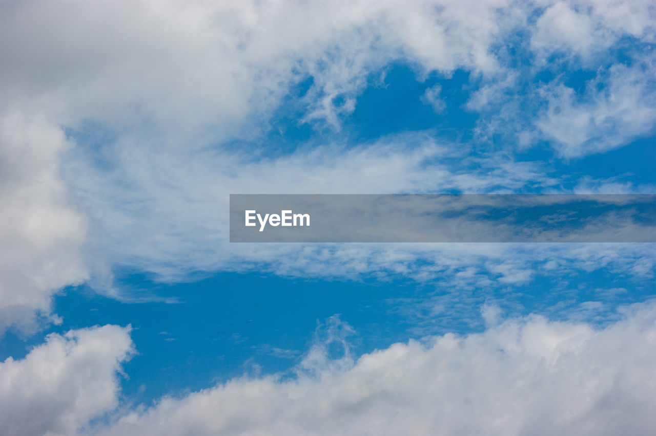 sky, cloud, blue, cloudscape, daytime, environment, backgrounds, nature, beauty in nature, atmosphere, wind, scenics - nature, white, dramatic sky, no people, overcast, idyllic, meteorology, outdoors, tranquility, horizon, fluffy, space, summer, high up, azure, day, sunlight, light - natural phenomenon, vibrant color, tranquil scene, landscape, mid-air, moody sky, climate, copy space, panoramic, bright, flying, abstract