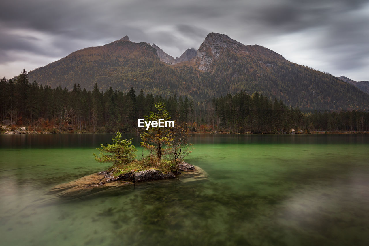Scenic view of lake and mountains against sky