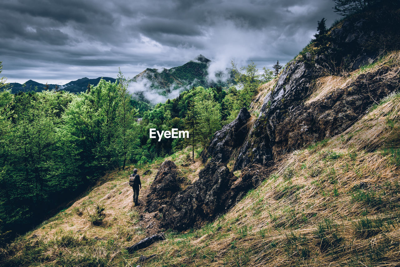 Man explore the old mines in mountain concept of leisure activity and hiking in the mountains